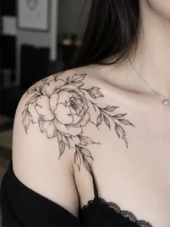 Fine line peony flower and leaves shoulder tattoo