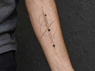 Minimalist geometric circles and lines forearm tattoo