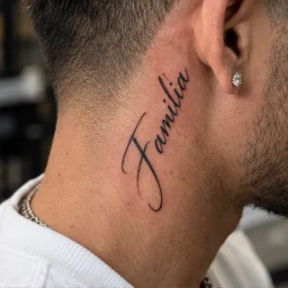 Script lettering familia word neck tattoo