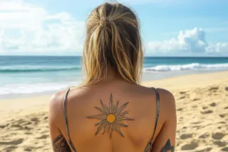Minimalist sun and rays upper back tattoo