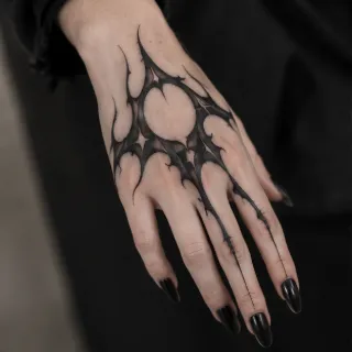 Abstract blackwork organic bio organic hand tattoo