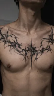 Blackwork abstract thorn and star chest tattoo
