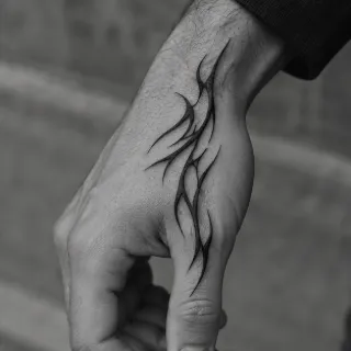 Blackwork tribal style abstract flame hand tattoo