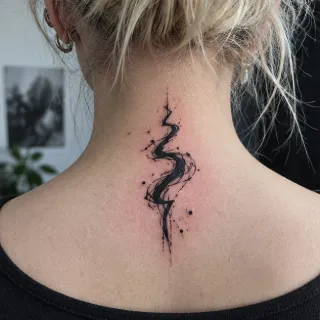 Abstract brushstroke and dotwork back of neck tattoo