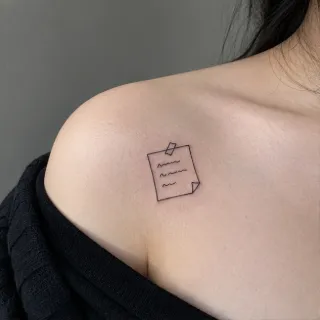 Minimalist fine line sticky note collarbone tattoo