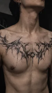 Abstract blackwork thorn and web chest tattoo