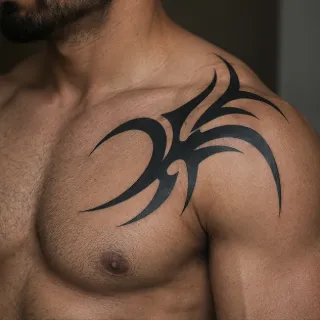 Bold black tribal chest and shoulder tattoo