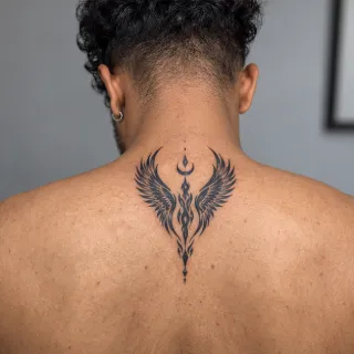 Blackwork wings and crescent moon upper back tattoo