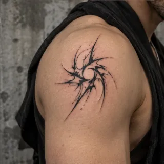 Abstract blackwork swirling star shoulder tattoo