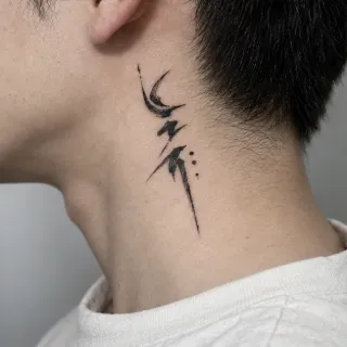 Abstract brush stroke style neck tattoo with dots
