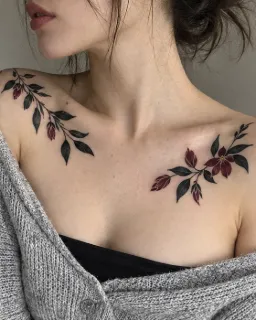Dark floral branch collarbone and shoulder tattoo