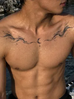 Fine line crescent moon and abstract wave chest tattoo