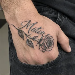Script name and rose flower hand tattoo